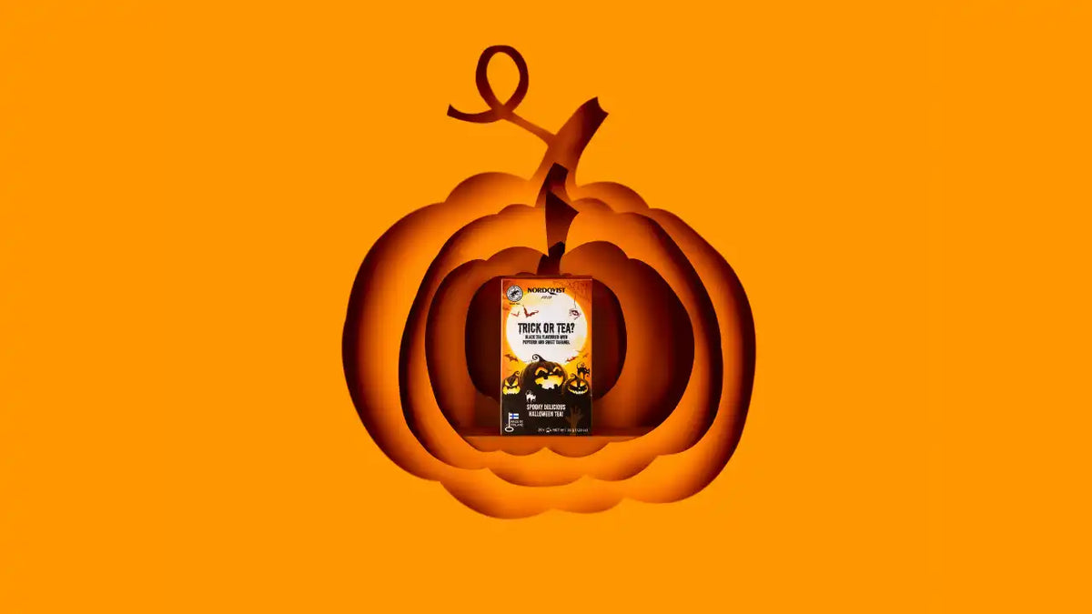 Halloween-themed coffee pods in a pumpkin cutout.